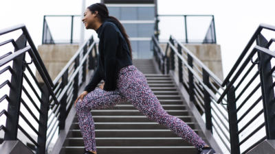 woman on steps stretching before exercise